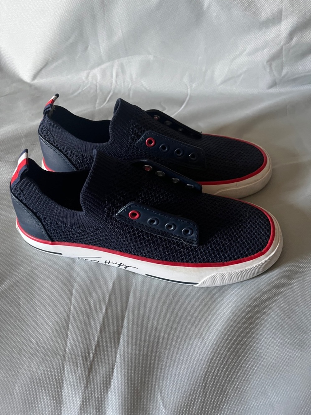 Women’s  Tommy Hilfiger size 6 Slip-On Knit Sneakers - Navy with Red Trim